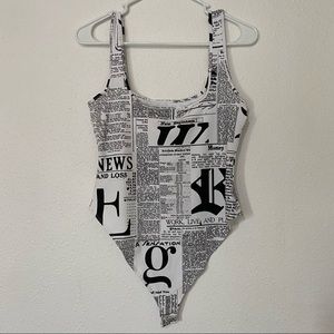 Medium large newspaper print black and white onesie top leotard